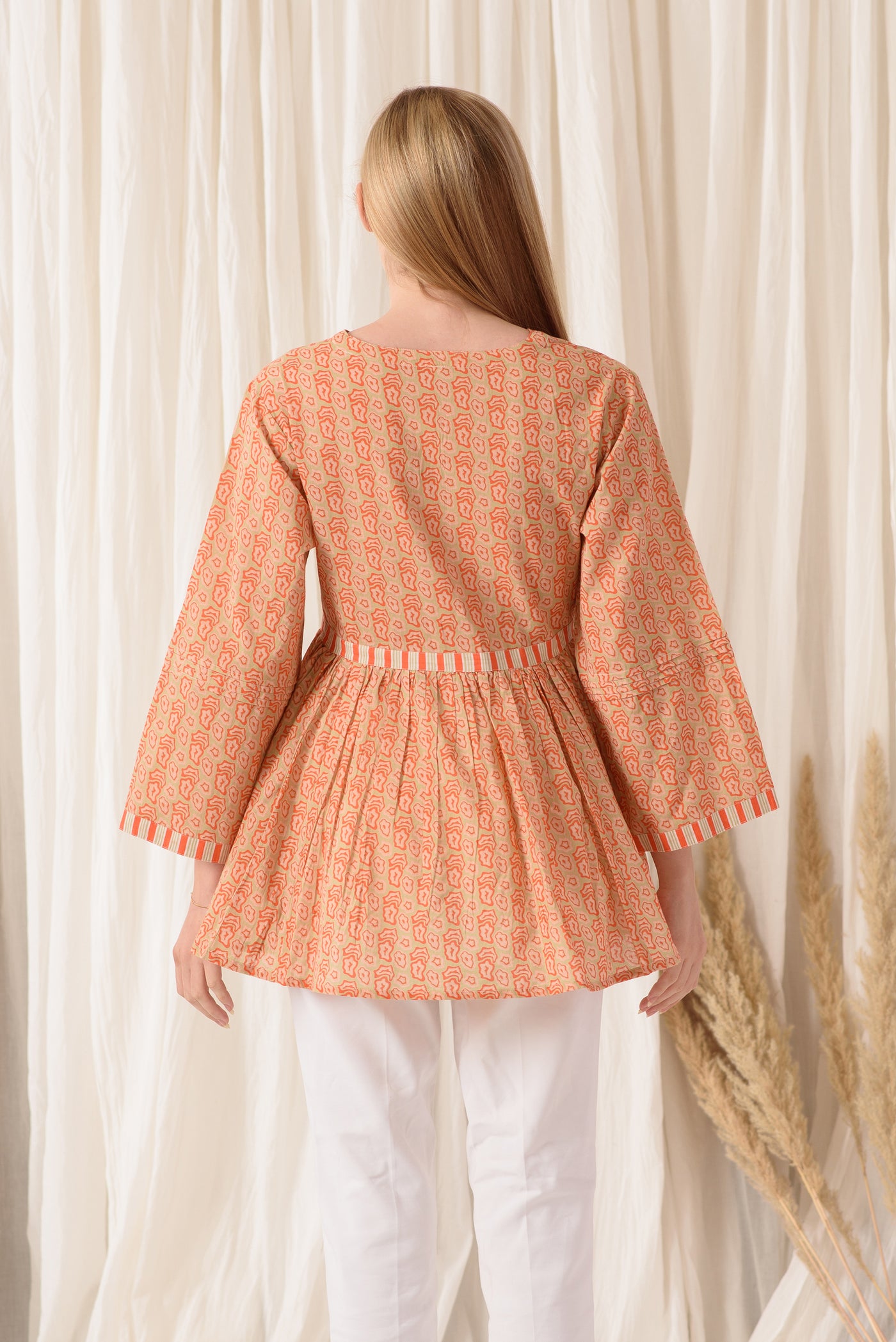 THE PLEATED TOP IN TANGY ORANGE